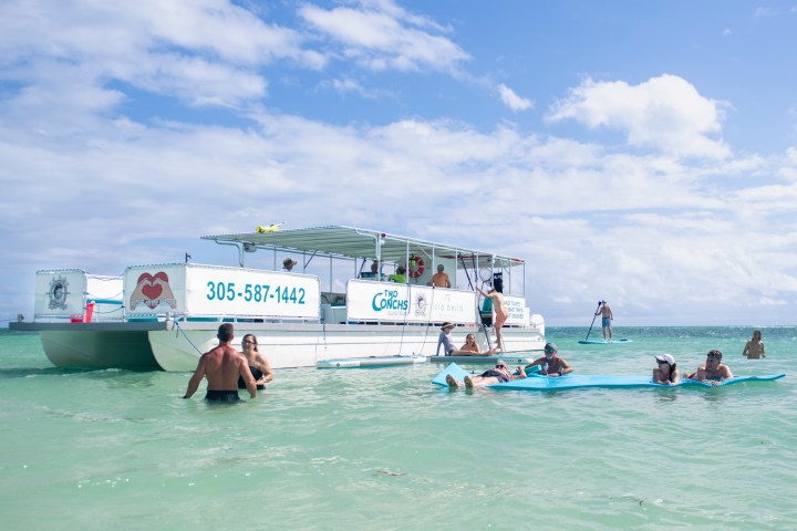 a group of people on a boat in the water